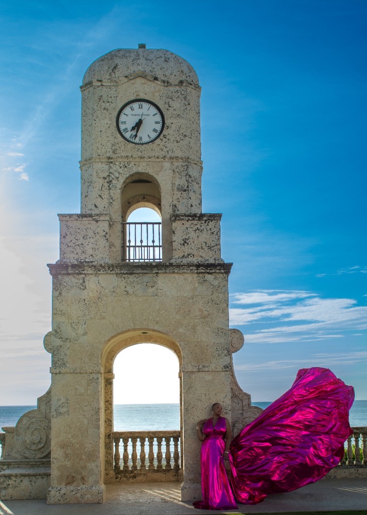 Flying dress photoshoot at the Worth Avenue Clock Tower — metallic magenta gown